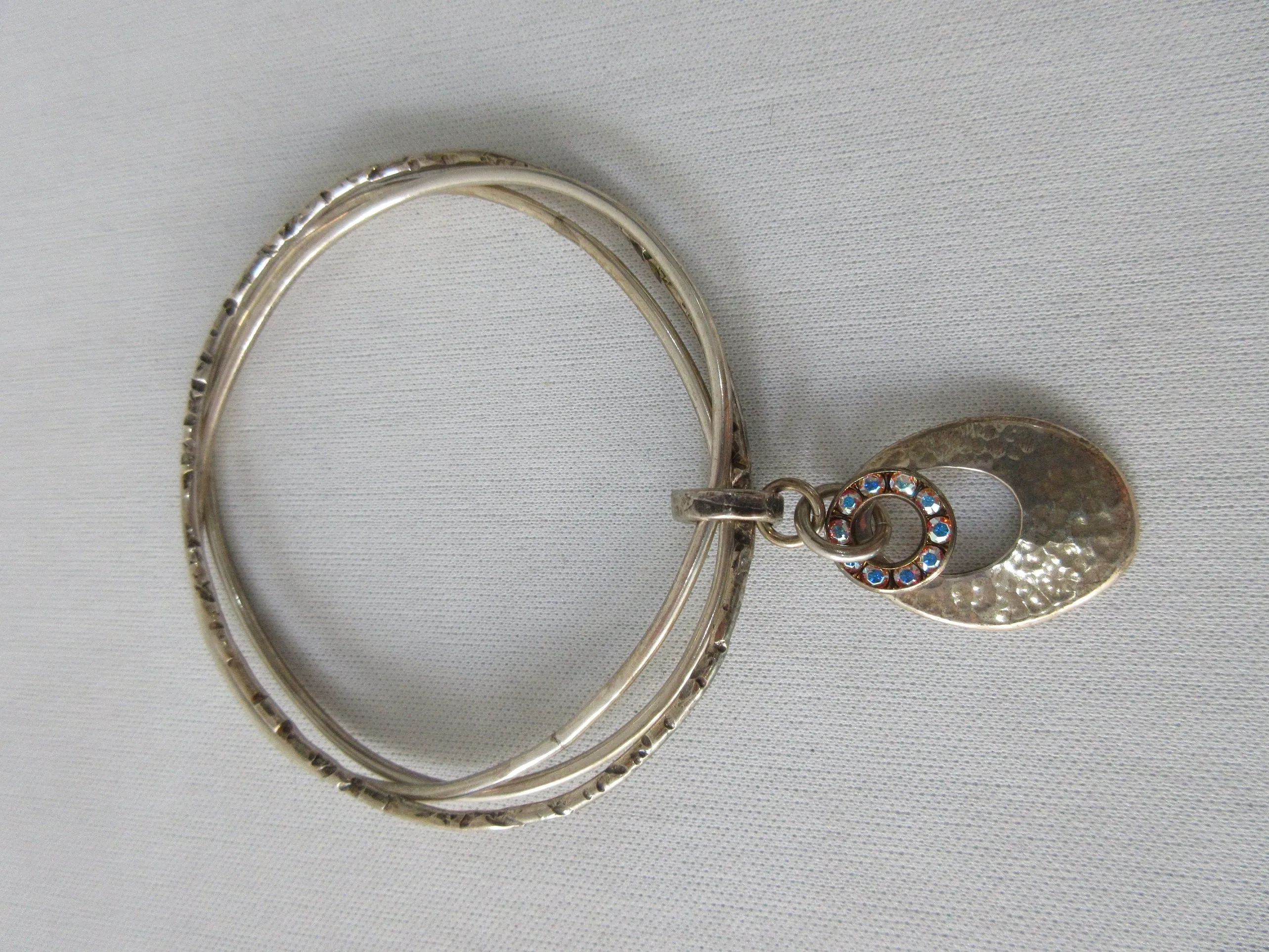 20A43 -Karyn Chopik Multi 3 Ring Bracelet with Hollow Teardrop and Crystal Ring