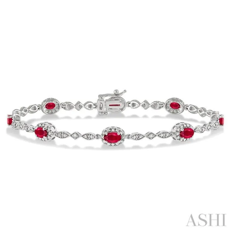 5x3MM Oval Cut Ruby and 1/20 Ctw Single Cut Diamond Bracelet in 14K White Gold